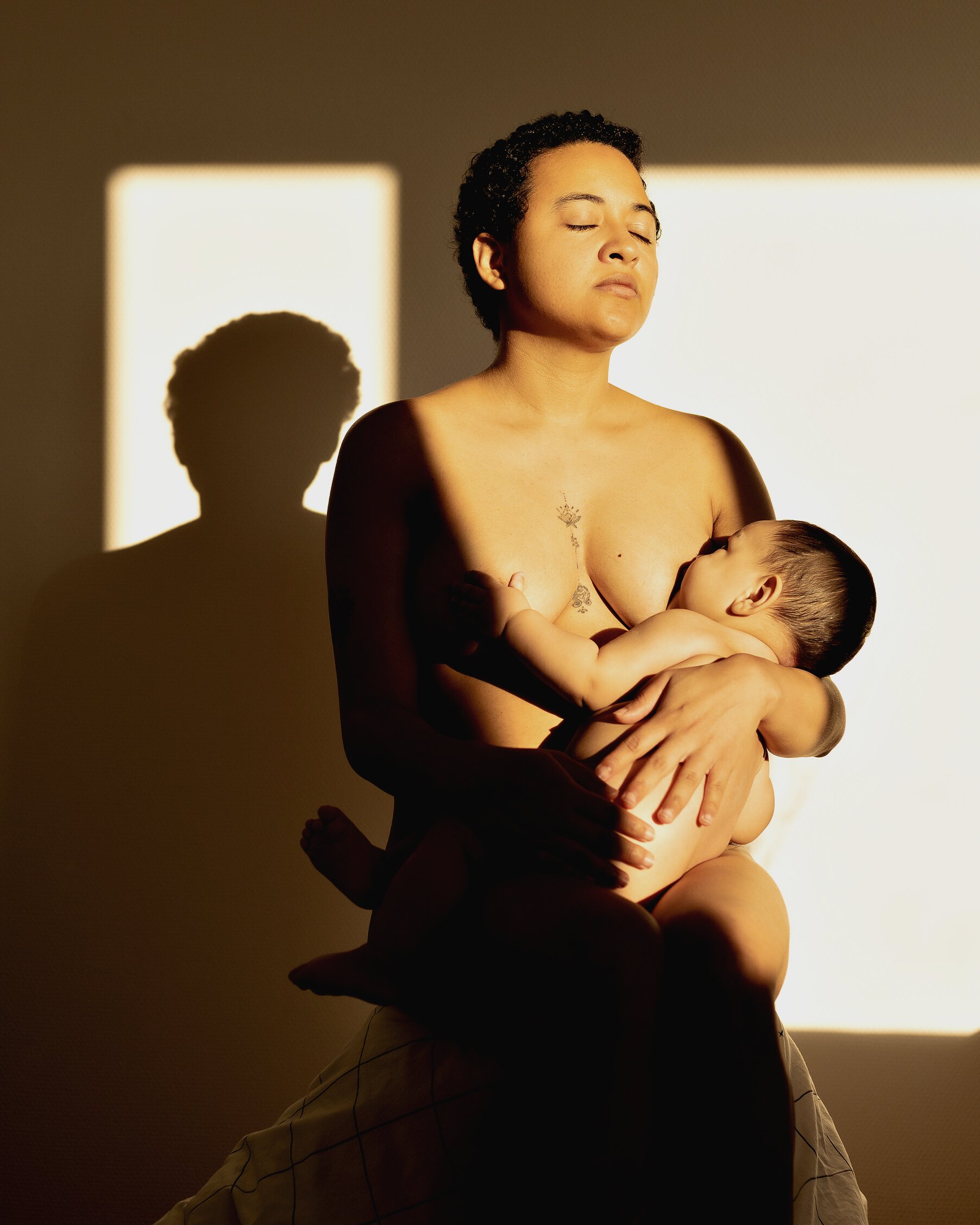 Naked Woman Feeding her Baby